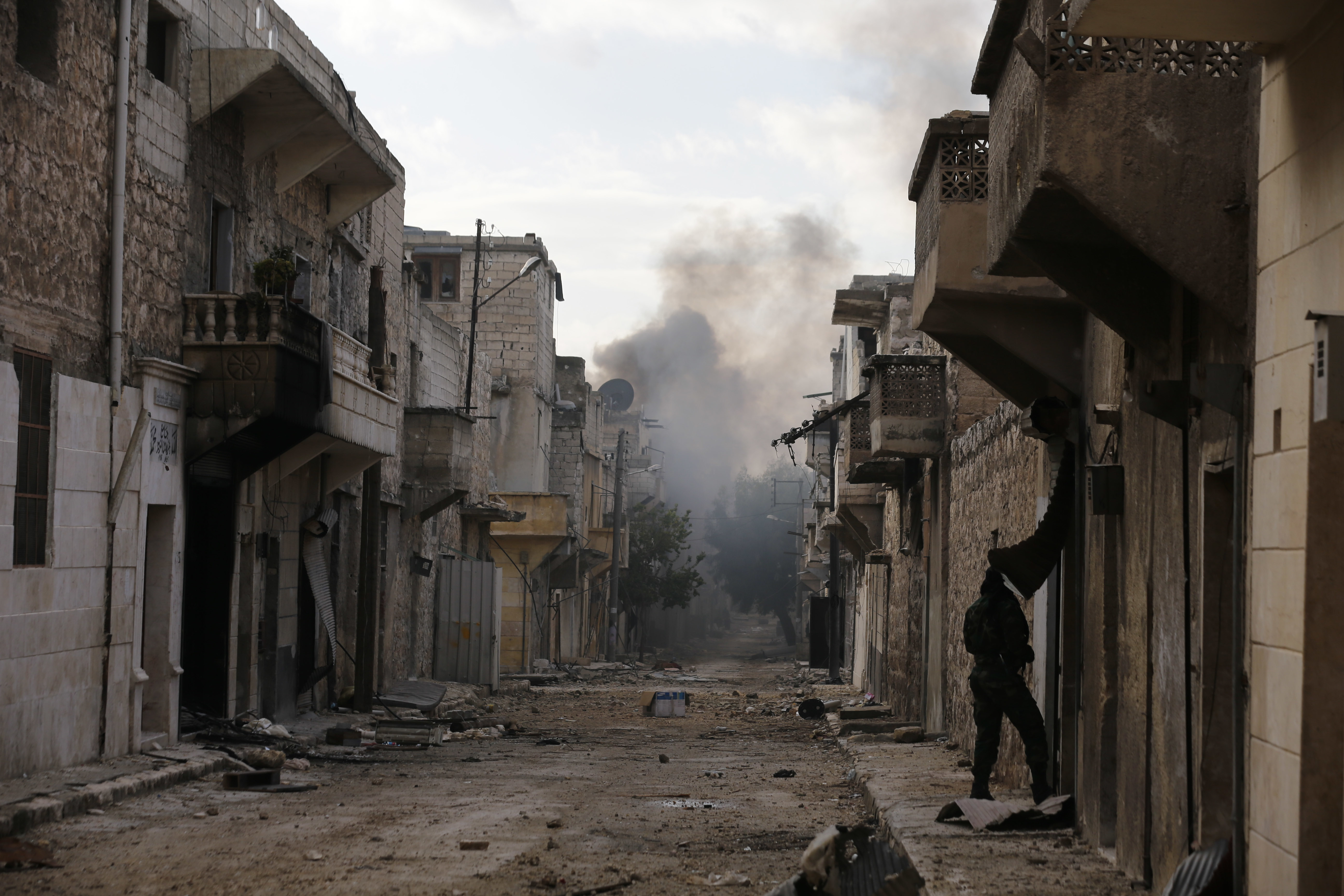 Smoke rises in an east Aleppo neighborhood