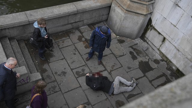 A man lies injured after a shooting incident