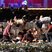 Image 8: Country music fans hide as a maniac sprayed bullets at the audience in Las Vegas